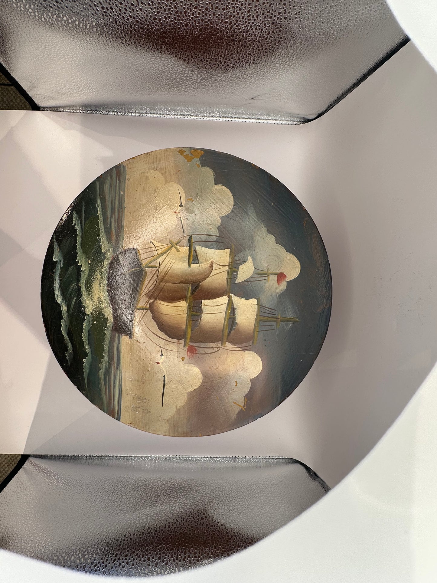 Painted lid showing a ship with full sails against a bright sky