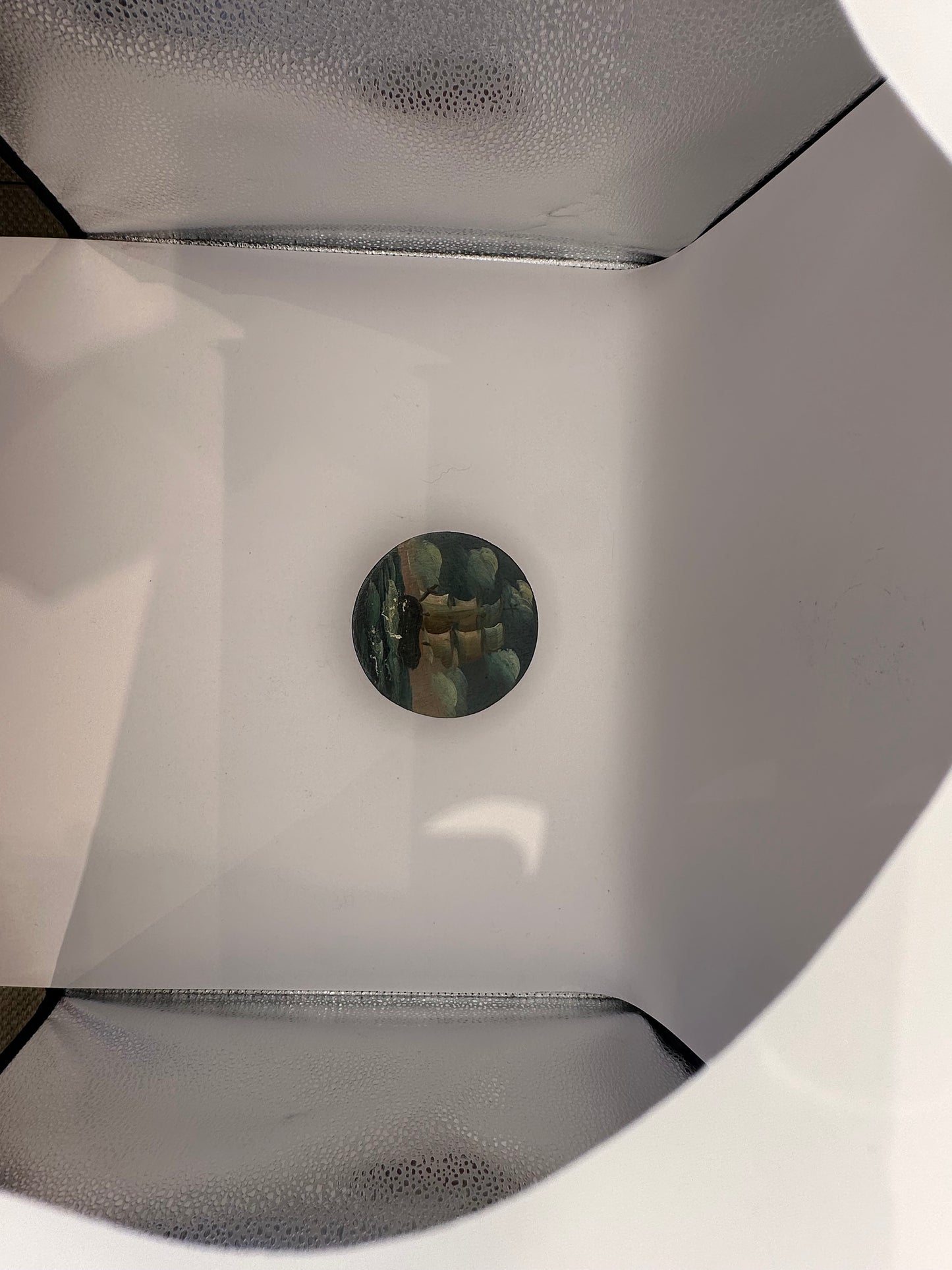 Small painted lid with a distant sailing ship in a sea scene