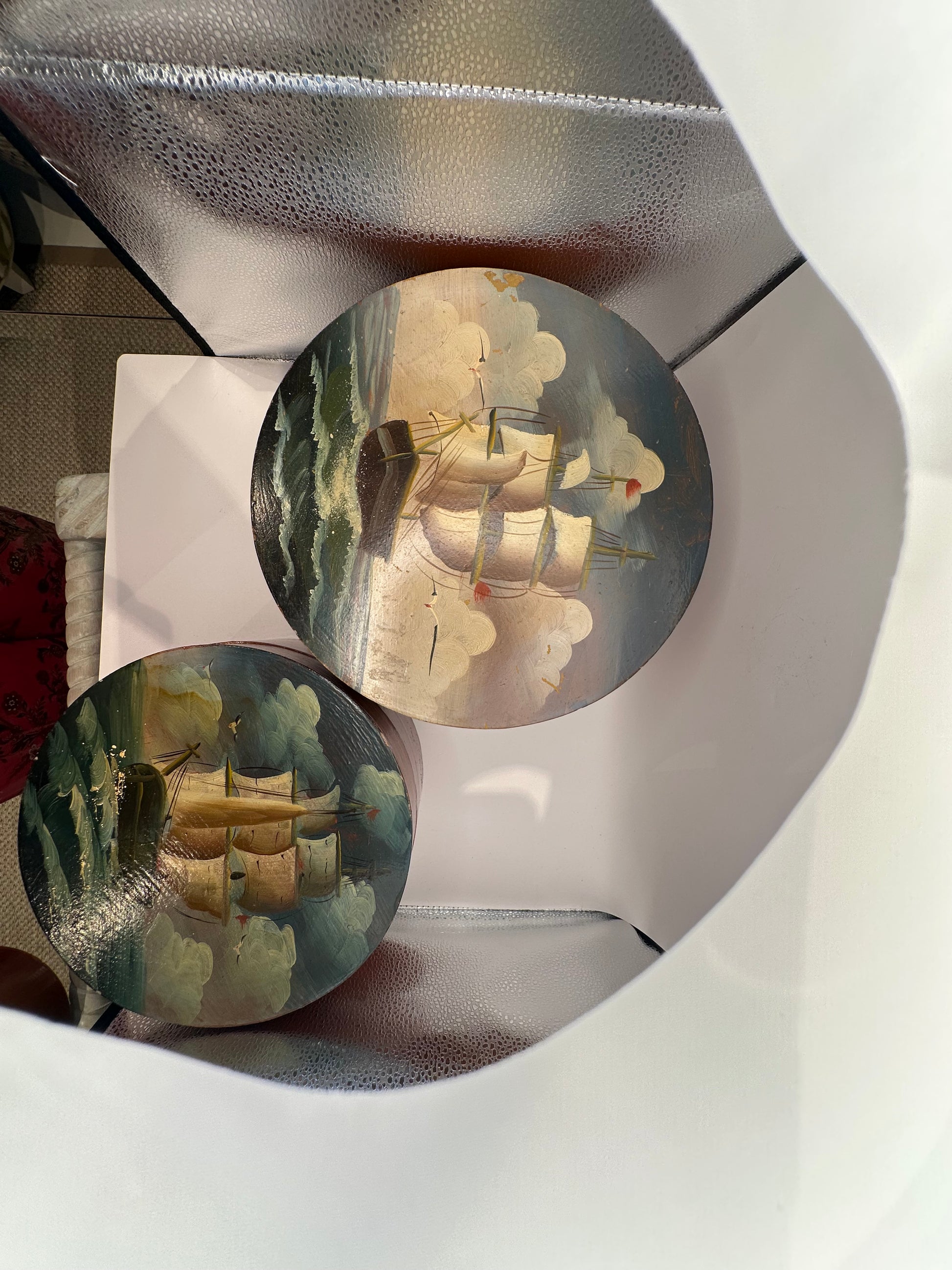 Hand-painted papier-mache box lids showing sailing schooners at sea, top view