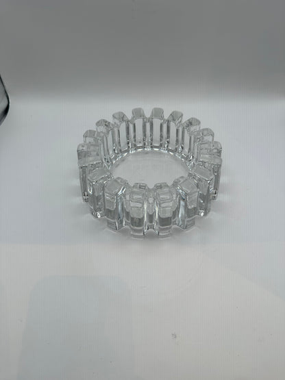 Vintage MCM heavy clear glass dish with blocky notched rim, three-quarter view