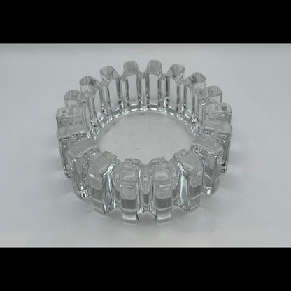 MCM notched clear glass dish viewed lower angle, highlighting blocky cut pattern