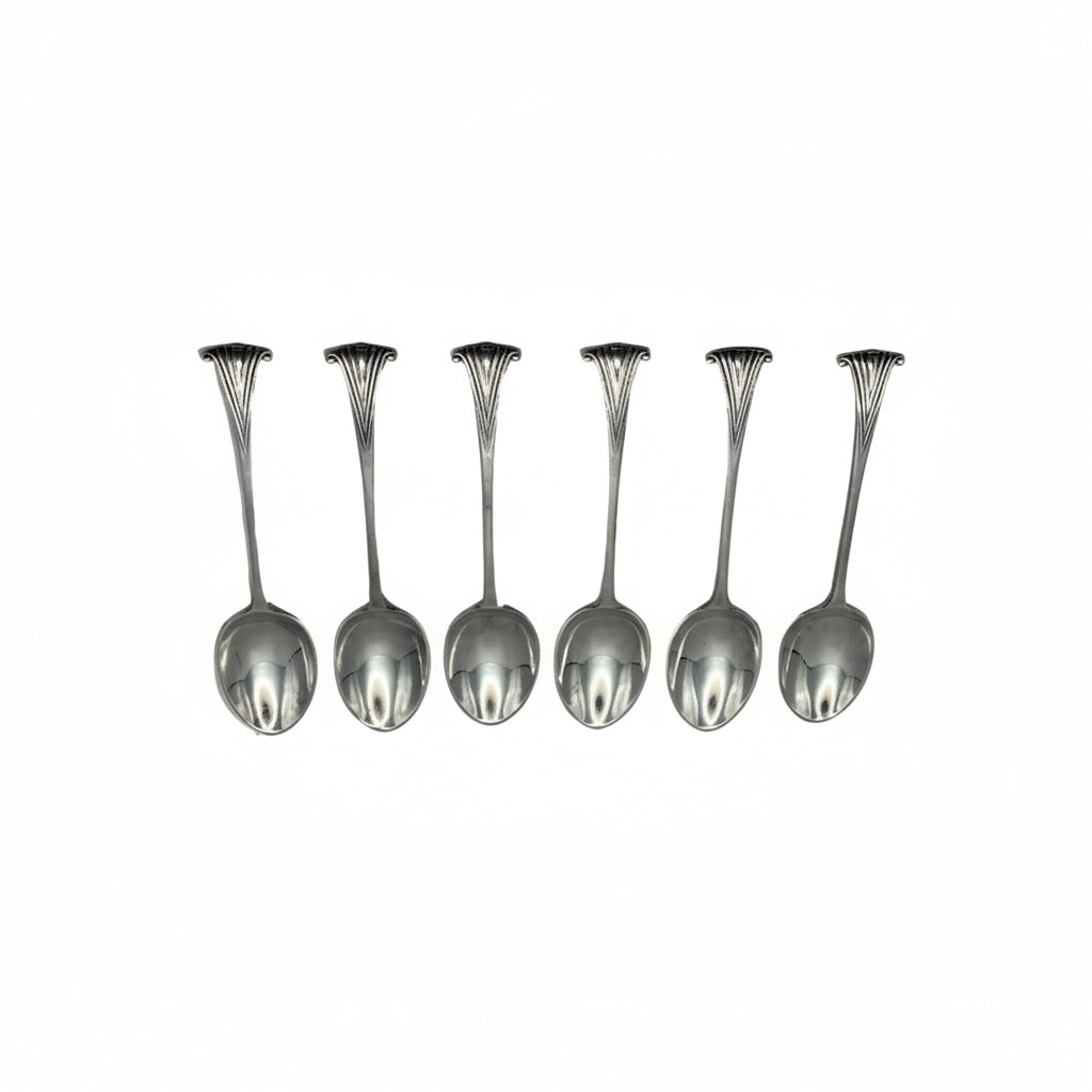 Set of six antique silverplate demitasse spoons with fanned scroll-shell handle terminals, oval bowls, displayed in a row