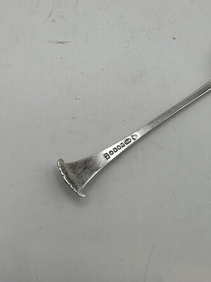 Back of a demitasse spoon handle terminal showing hallmark stamps along the silverplate stem