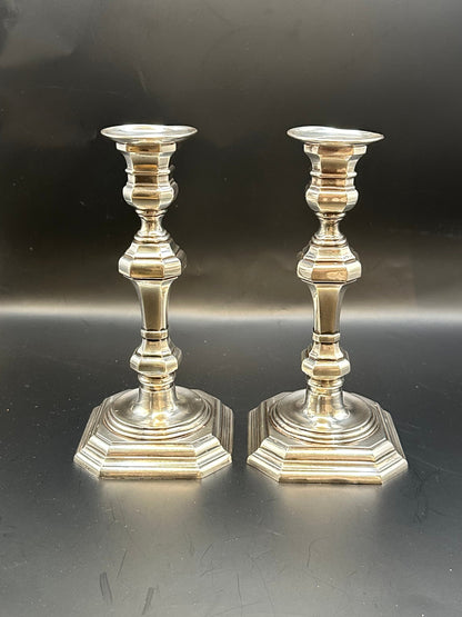 Pair of Georgian Revival silver plate candlesticks, baluster stems and stepped octagonal bases
