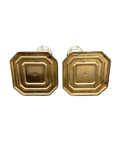 Underside of Georgian Revival candlesticks showing recessed octagonal weighted bases
