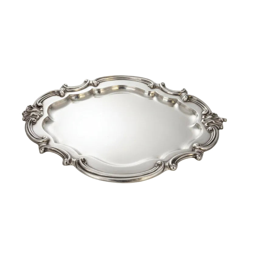 Vintage Rococo Revival silver plate tray with scrolled openwork rim and shell handles, on white