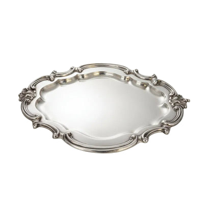 Vintage Rococo Revival silver plate tray with scrolled openwork rim and shell handles, on white