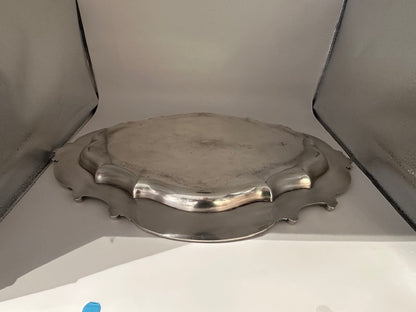 Vintage Rococo Revival silver plate tray, slightly tarnished, displayed in a light box