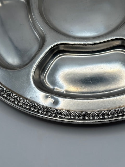 Close-up of Gorham divided tray sections showing polished silver compartments and beaded rim