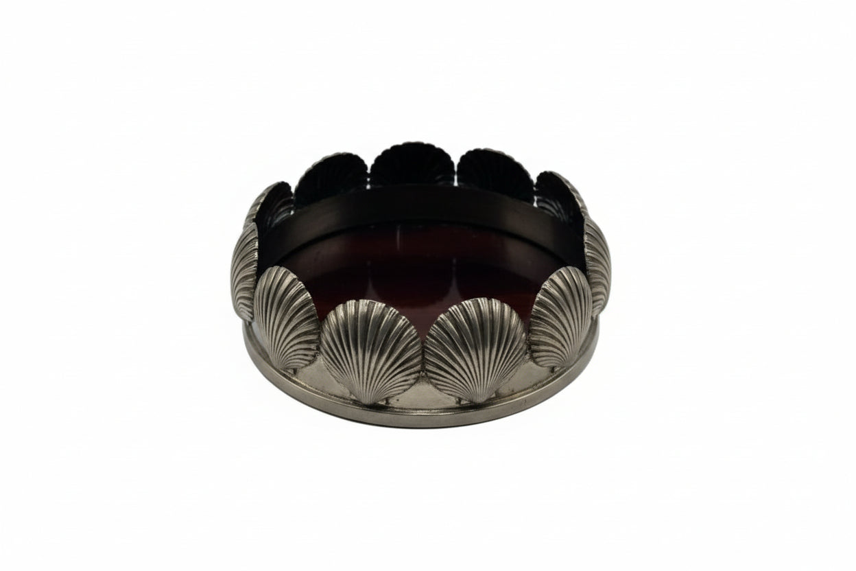 Silverplate bottle coaster with scallop shell sides and dark mahogany base, front view
