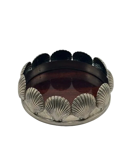 Shell-design silverplate bottle coaster with mahogany base, front view