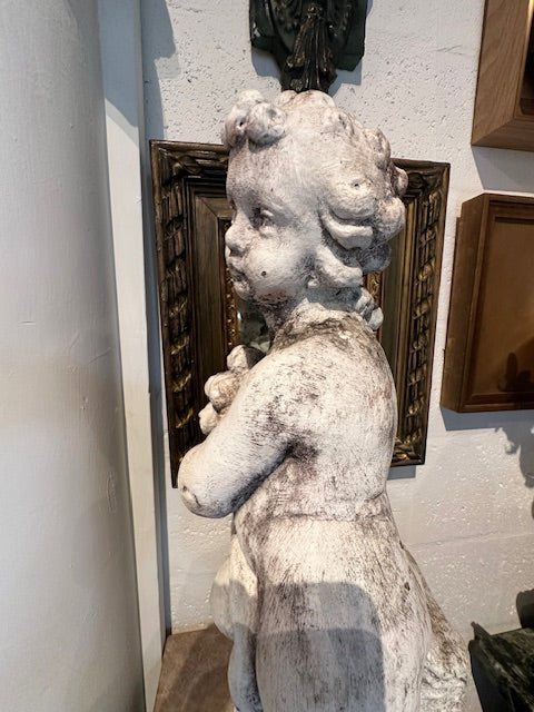 Concrete Autumn cherub statue, side profile close-up of head and shoulders