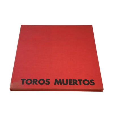 Vintage book Toros Muertos, 1966, red cloth hardcover lying flat with black title lettering