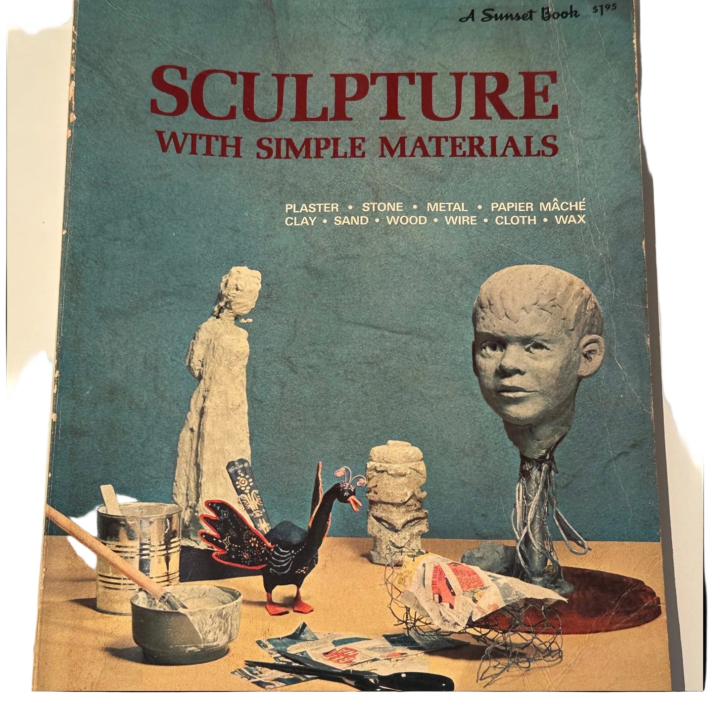 Cover of "Sculpture With Simple Materials," a 1970 Sunset Book, with clay and papier-mache sculptures