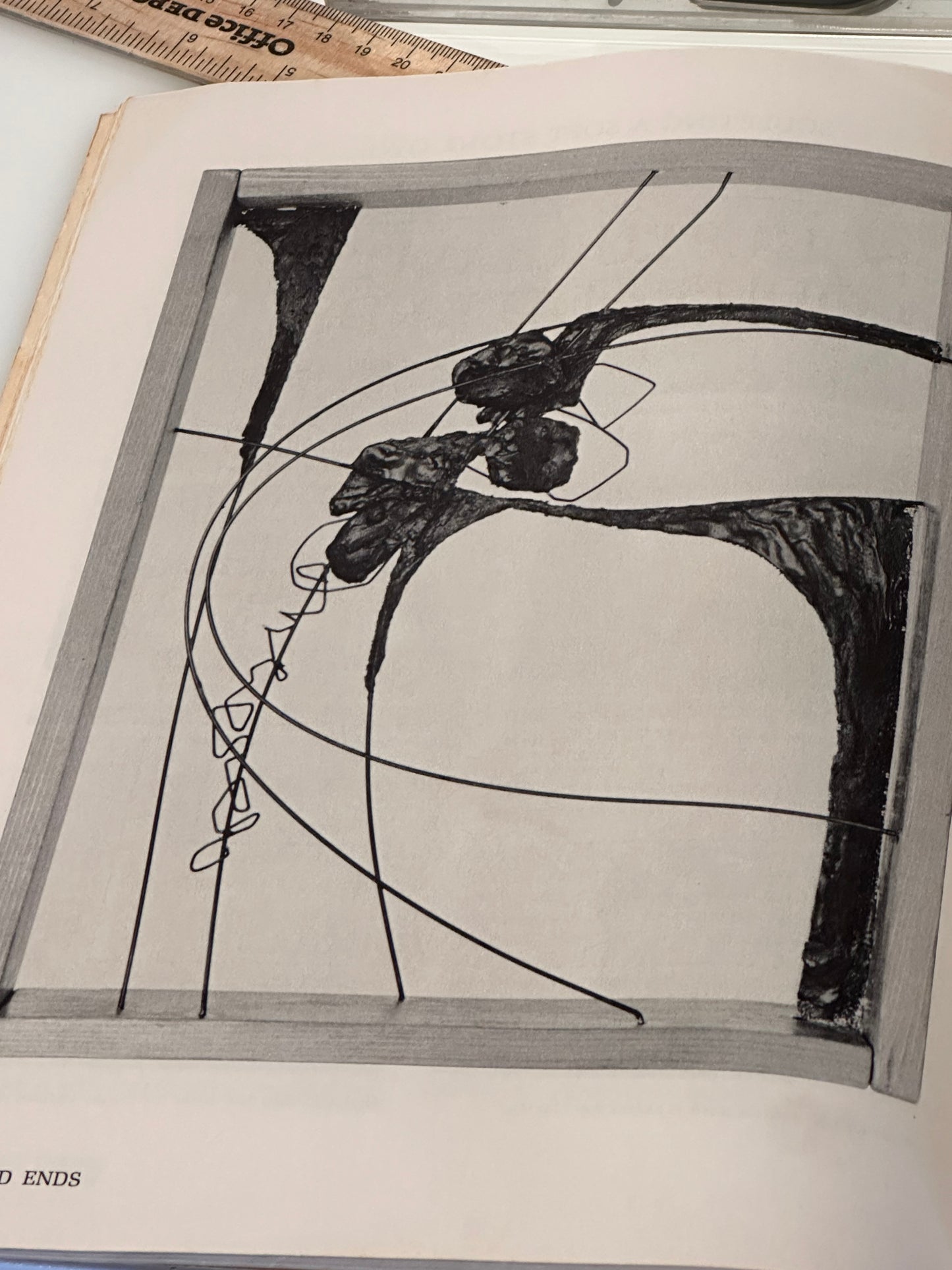 Interior page of sculpture book showing a black ink construction drawing of an abstract form
