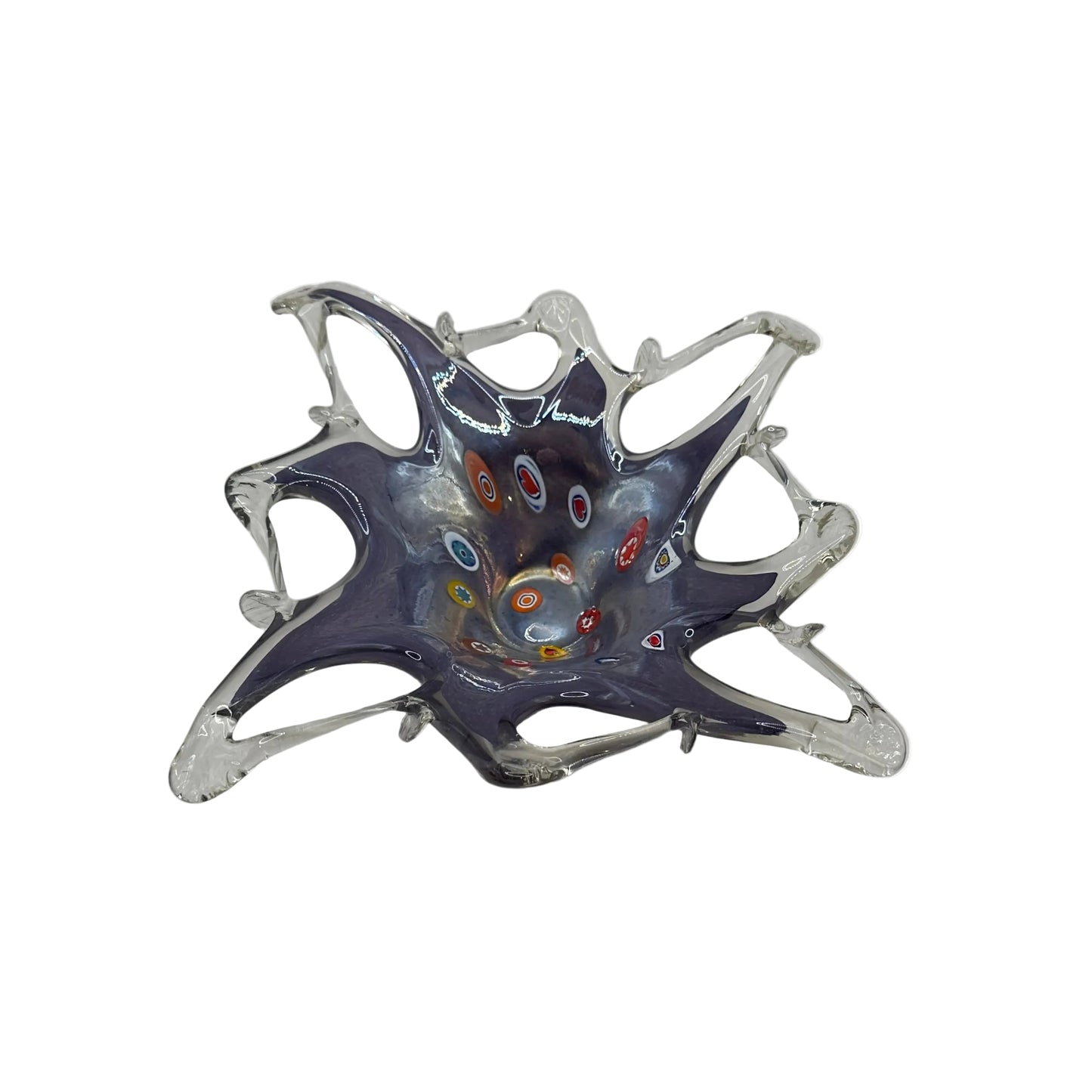 Angled view of Murano-style lavender glass dish with millefiori canes and pulled clear points
