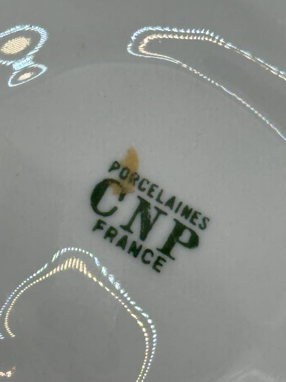 Close-up of maker's mark on oyster dish reading Porcelaines CNP France