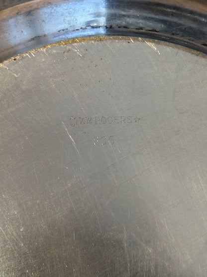 Close-up of 'Wm Rogers 835' maker's mark stamped on bowl underside