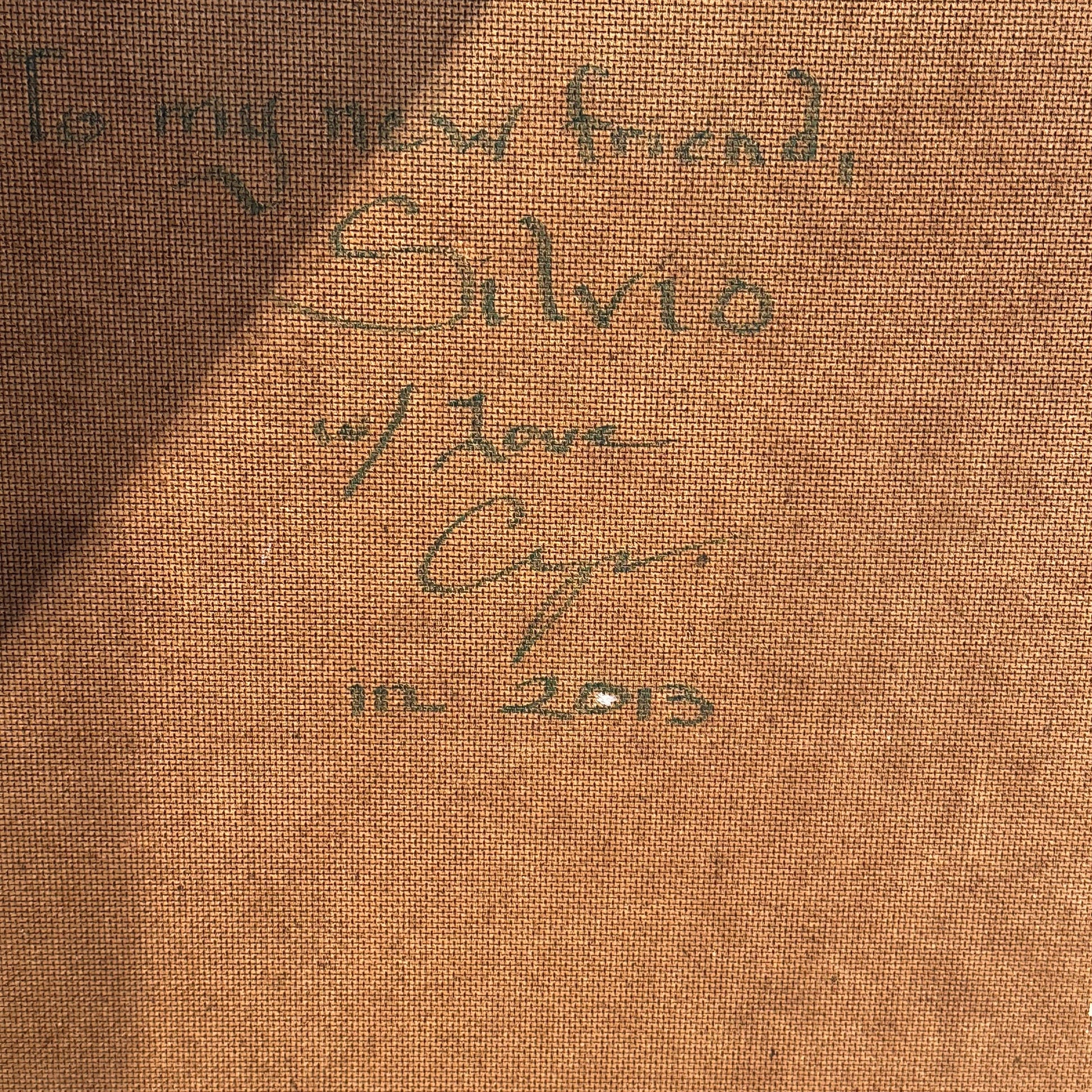 Close-up of green handwritten inscription on the reverse: "To my new friend, Silvio w/ Love," dated 2013.