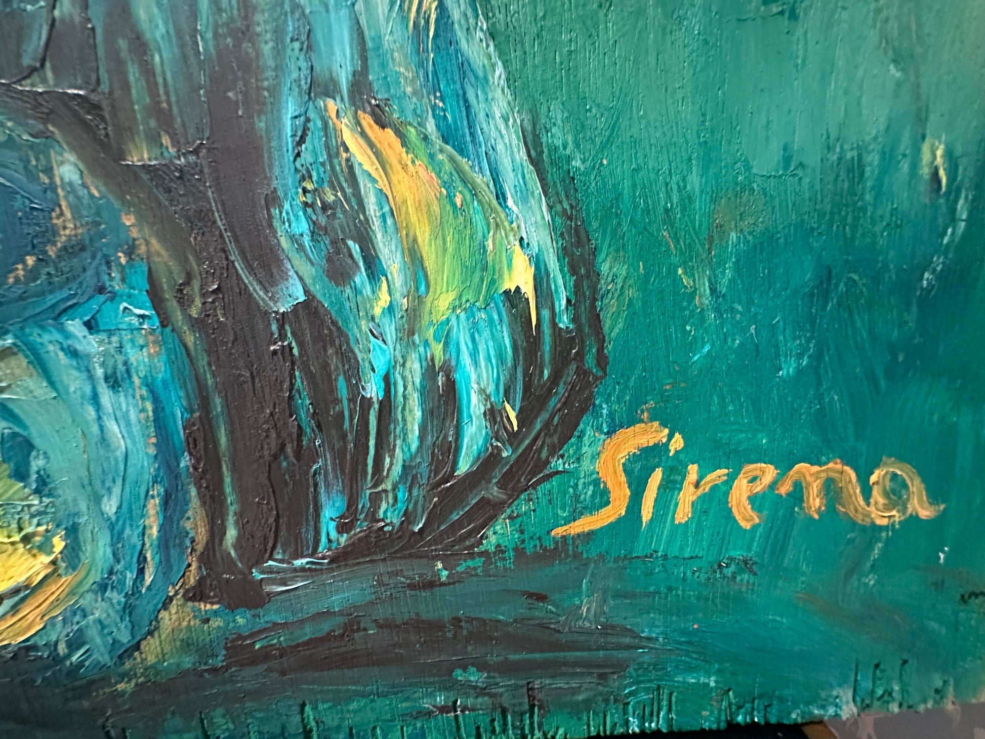 Close-up of the gold "Sirena" signature in the lower corner of the still life painting.