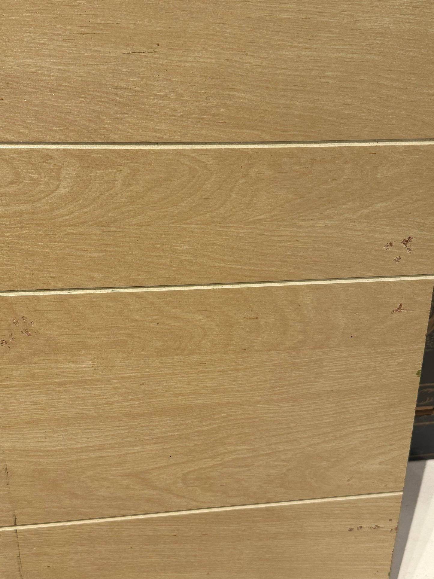 Reverse of the MCM still life panel showing the natural wood-grain plywood backing.