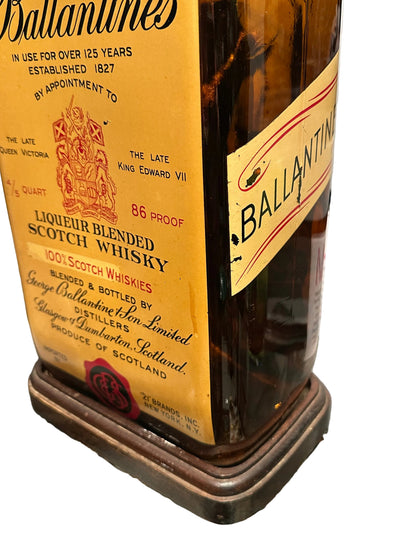 Bottle base and label detail with '21 Brands' seal and coiled electrical cord
