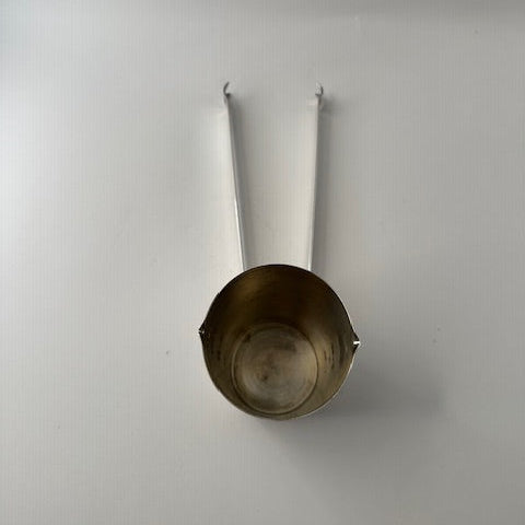 Top view of Napier silverplate jigger cup showing the interior, with folding ice tongs extended.