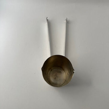 Top view of Napier silverplate jigger cup showing the interior, with folding ice tongs extended.