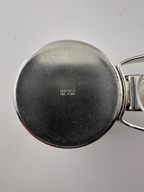 Close-up of the underside maker's mark reading "NAPIER PAT. PEND." on the silverplate jigger cup.