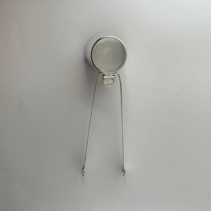 Napier silverplate 4-in-1 bar tool from above, jigger cup with folded ice tongs forming the handle.