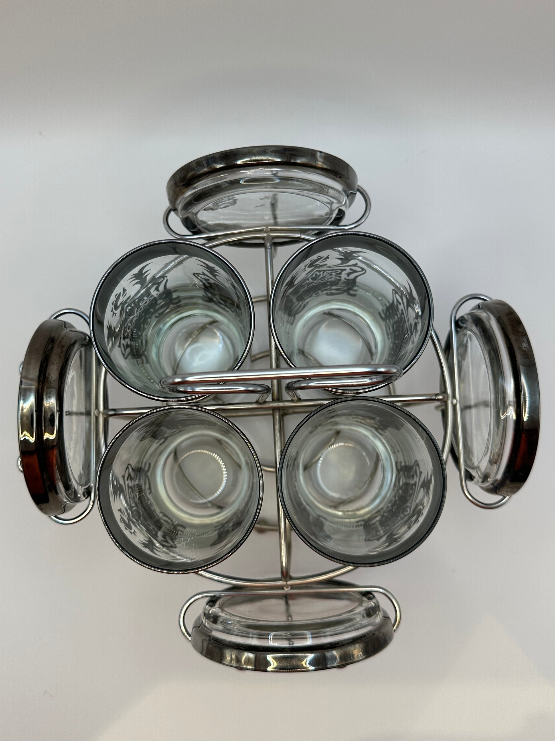 Top-down into the Kimiko barware caddy showing glass interiors and surrounding coasters.