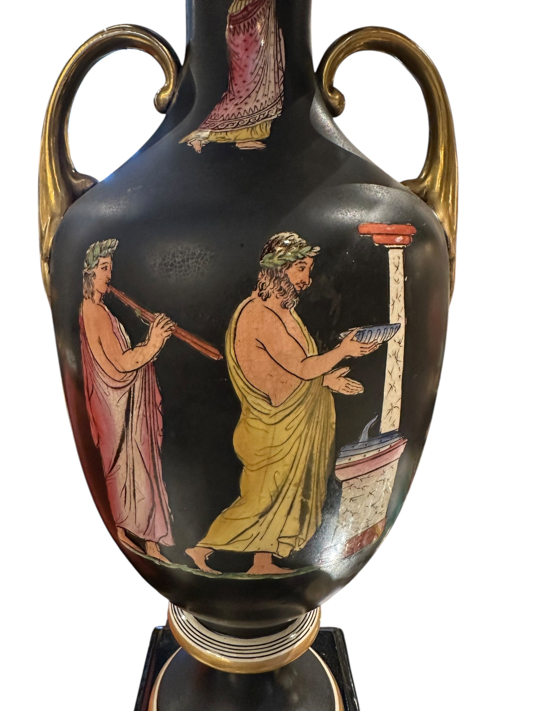 Close-up of the black lamp's painted classical scene: robed figures beside a column