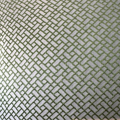 Close-up of the pillow's reverse in green and silver geometric lattice fabric