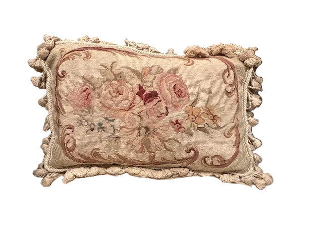 Vintage needlepoint throw pillow, front: rose floral bouquet on tan ground with cream cotton tassel fringe