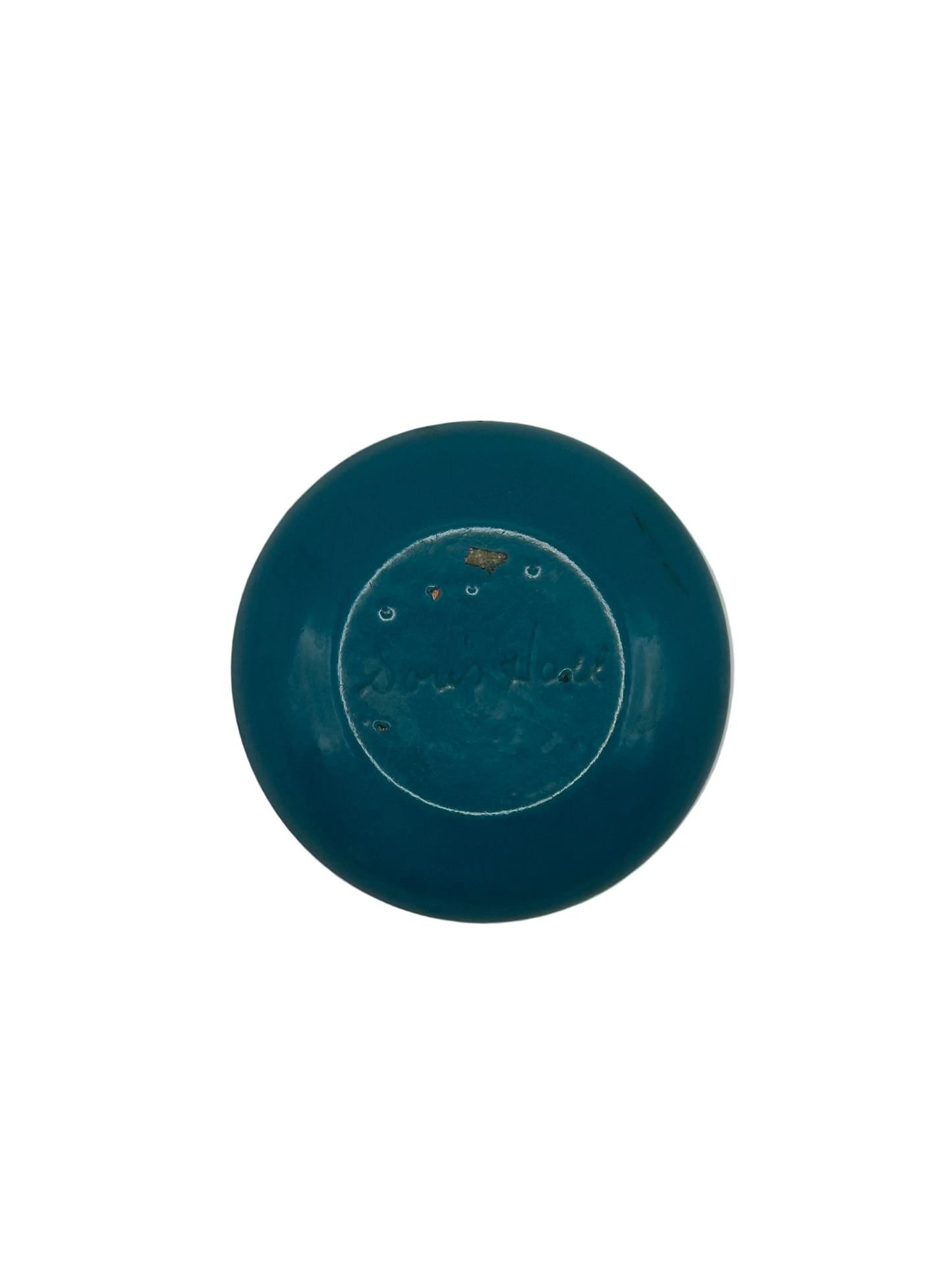 Underside of Doris Hall enamel dish, teal enamel with incised 'Doris Hall' signature