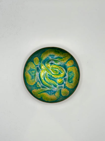 Doris Hall small enamel-on-copper dish, top view of green and yellow abstract swirl glaze
