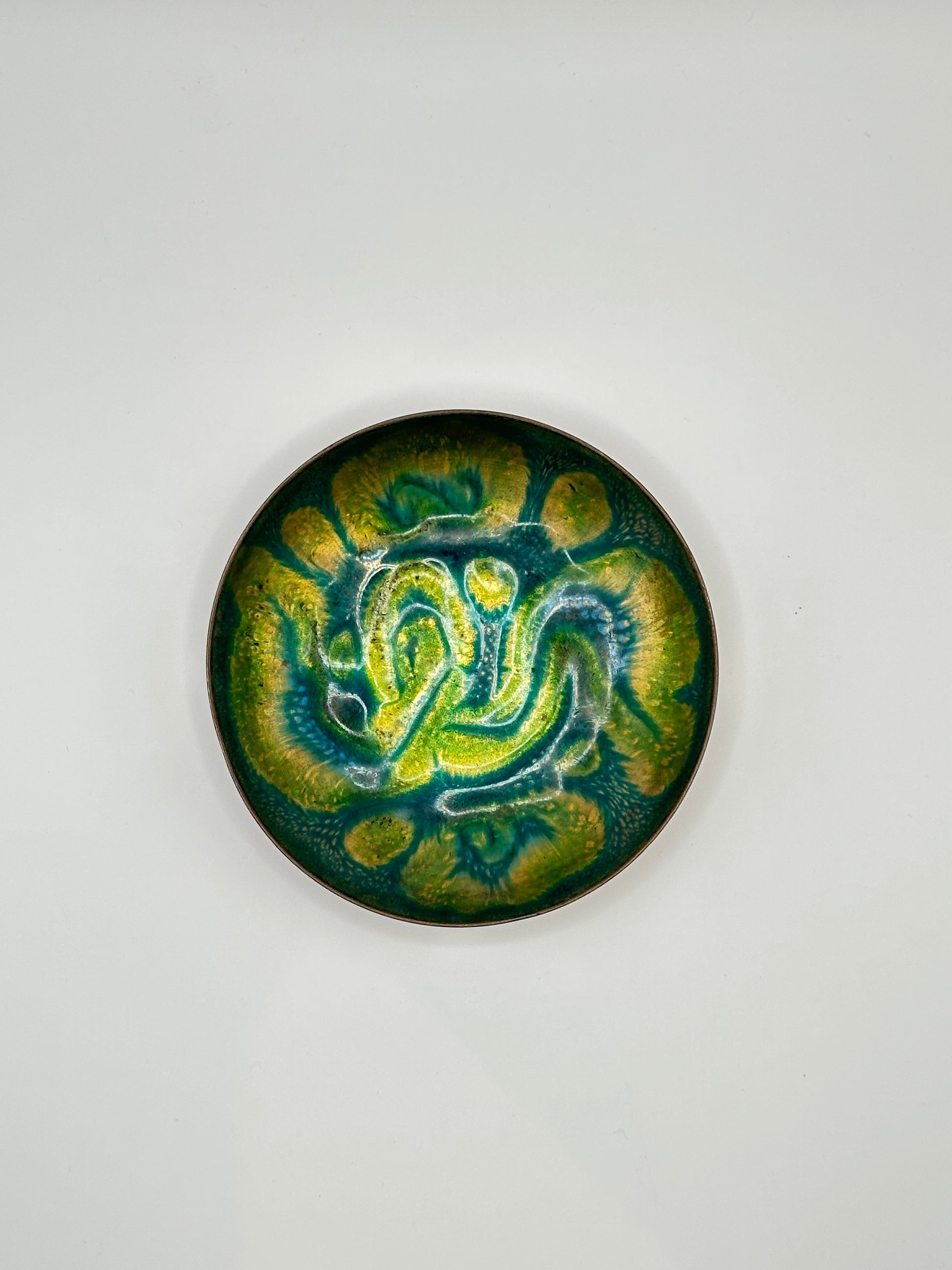 Doris Hall small enamel dish, green, yellow and teal abstract swirl glaze, overhead view
