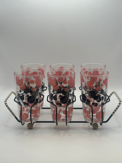 Front view of all six atomic polka-dot tumblers arranged in the black wire caddy