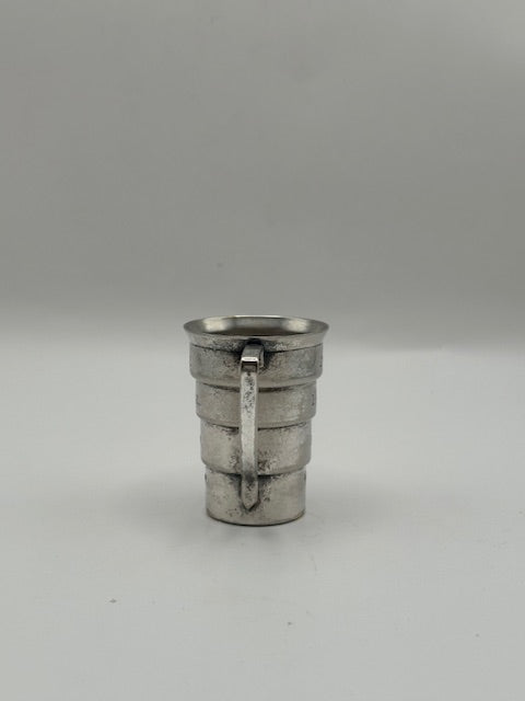 Vintage Art Deco silver-plate cocktail jigger, handle-side view of the stepped tiered body