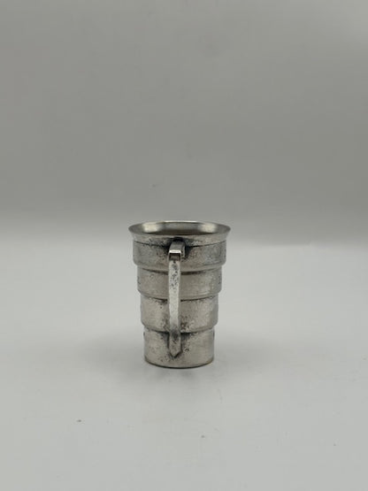 Vintage Art Deco silver-plate cocktail jigger, handle-side view of the stepped tiered body