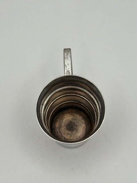 Vintage Art Deco silver-plate jigger, top-down view into the tarnished tiered interior and base