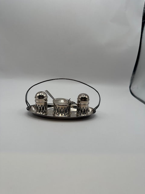 Silverplate cruet set on pierced oval stand, distant view