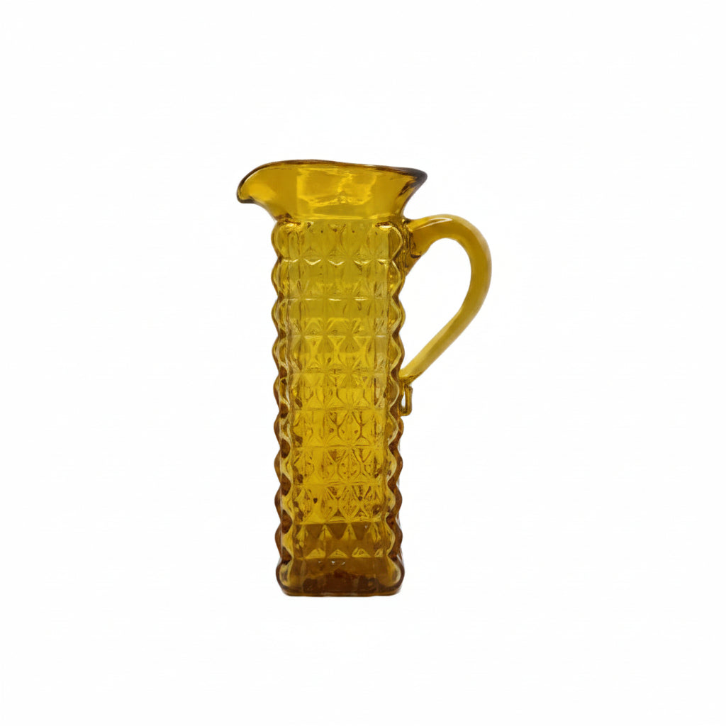 Vintage amber pressed-glass cruet with square diamond-pattern body and applied handle