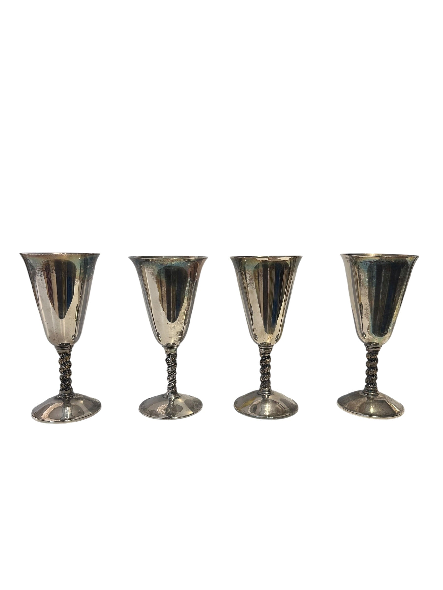 Set of four silver-plated vine-stem goblets lined up, front view