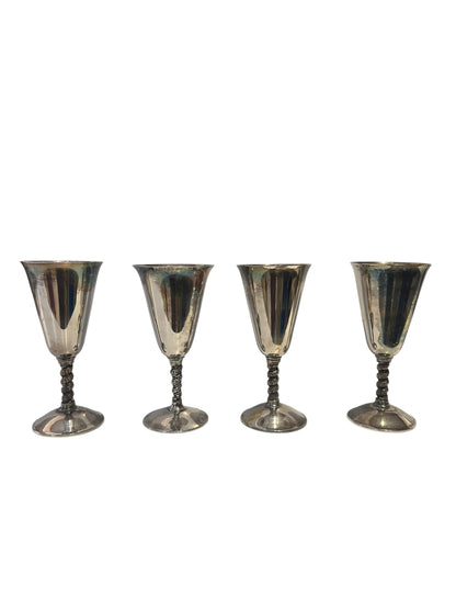 Set of four silver-plated vine-stem goblets lined up, front view