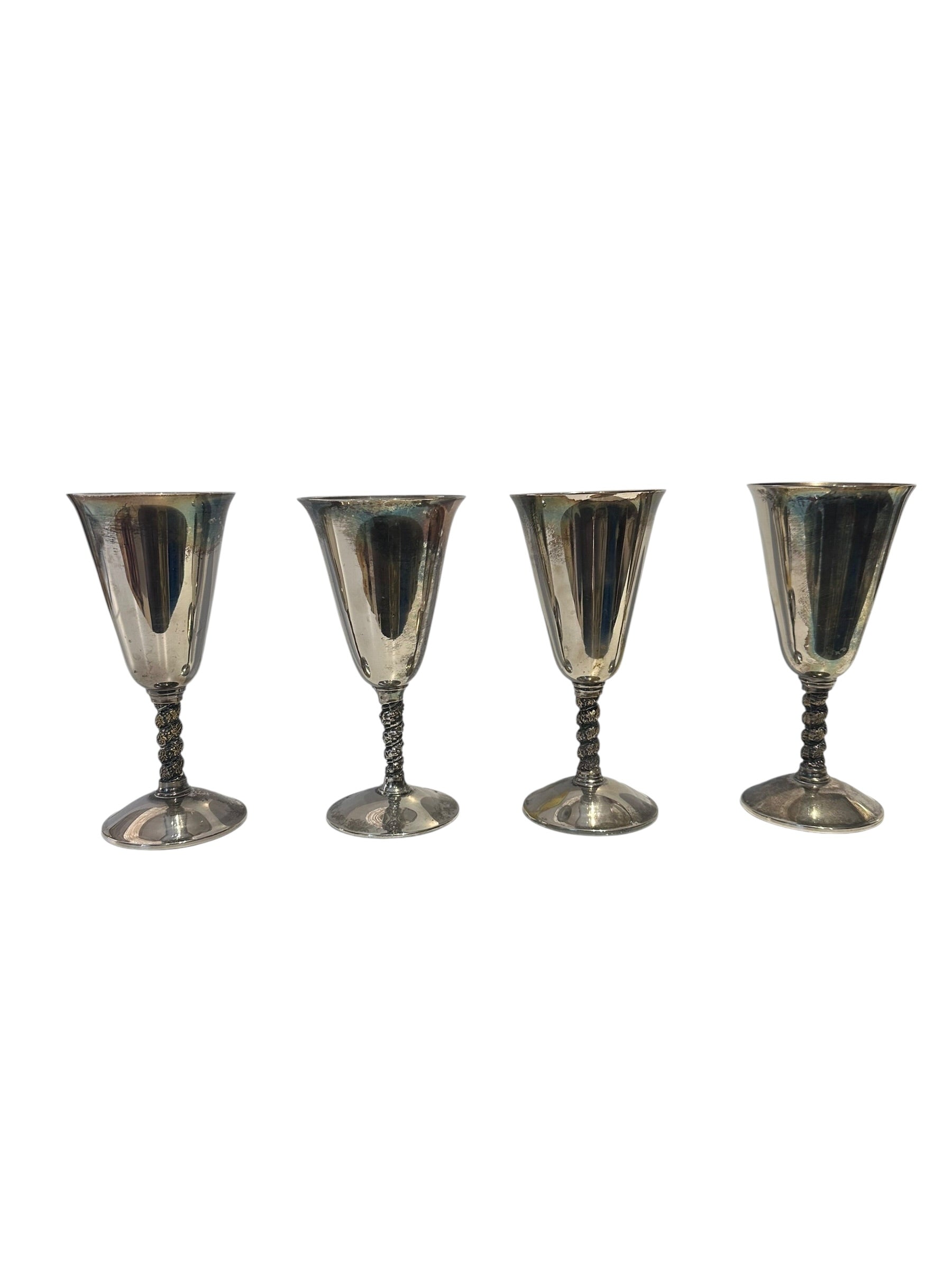 Set of four silver-plated goblets with vine-wrapped stems, angled view
