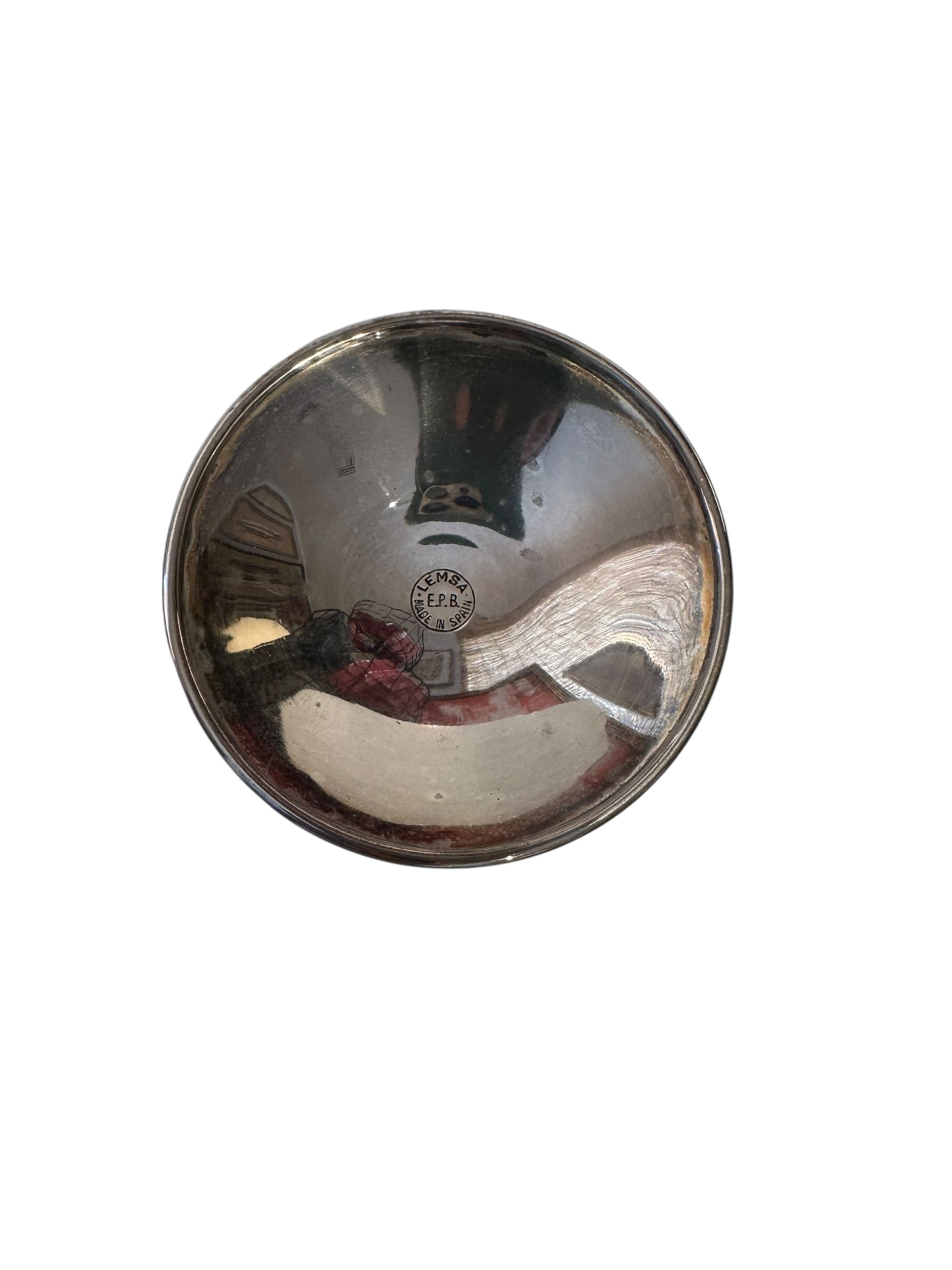 Silver-plated goblet interior showing reflective bowl and maker's mark stamp