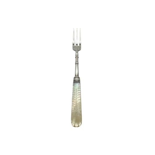 Three-tine sterling fork with carved mother-of-pearl handle, front view
