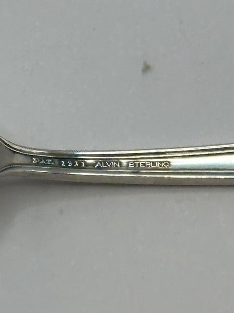 Close-up of Alvin Sterling hallmark stamped on the fork handle