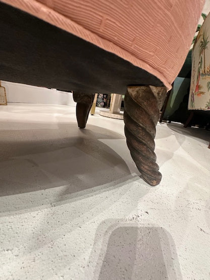 Antique pink coral boudoir chair, low-angle view of the barley-twist wood front leg